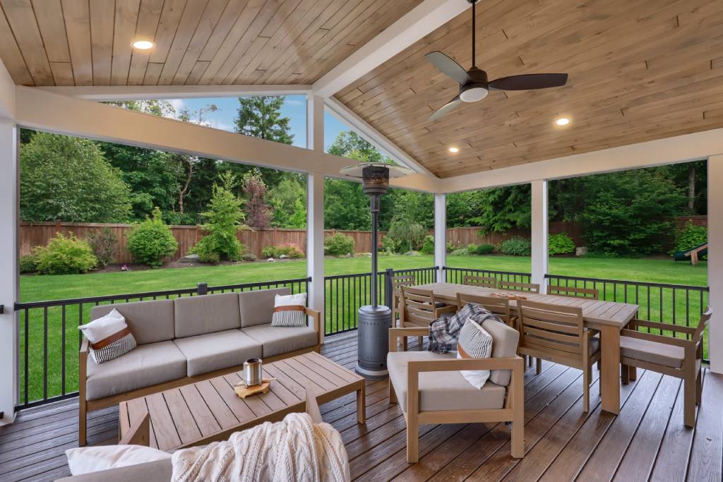 wood ceiling design with deck viewing backyard
