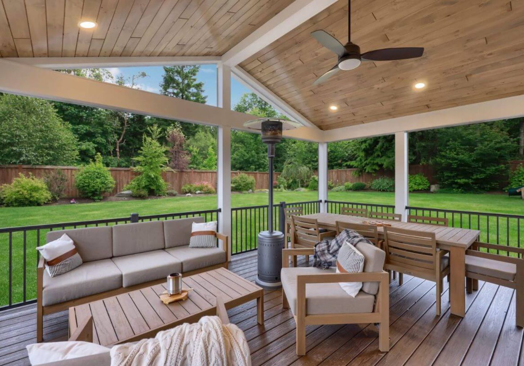 outdoor deck with ceiling, outdoor furniture surrounded by green yard