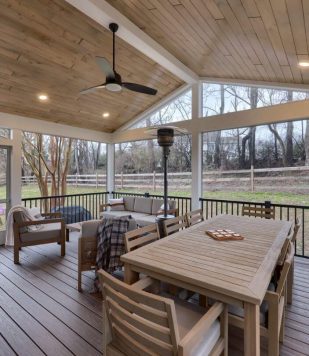 outdoor deck with wood paneling, flooring, and outdoor furniture