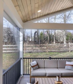 outdoor enclosed deck with wood paneling on ceiling and outdoor furniture