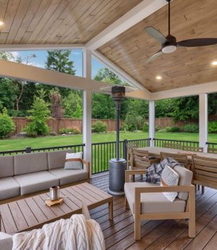 outdoor deck with ceiling, outdoor furniture surrounded by green yard